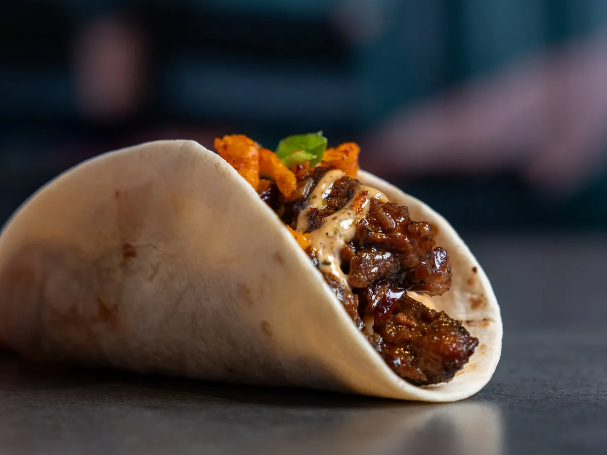 Umami Steak taco on a flour tortilla