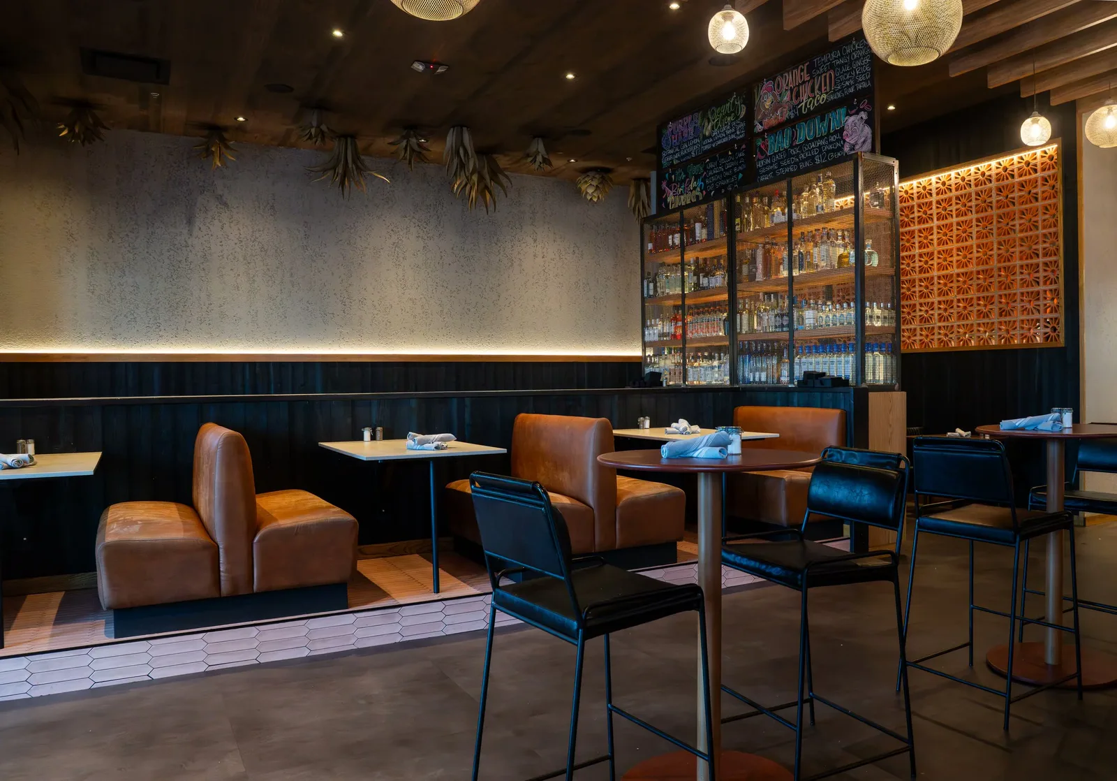 Leather booths under the dried agave ceiling