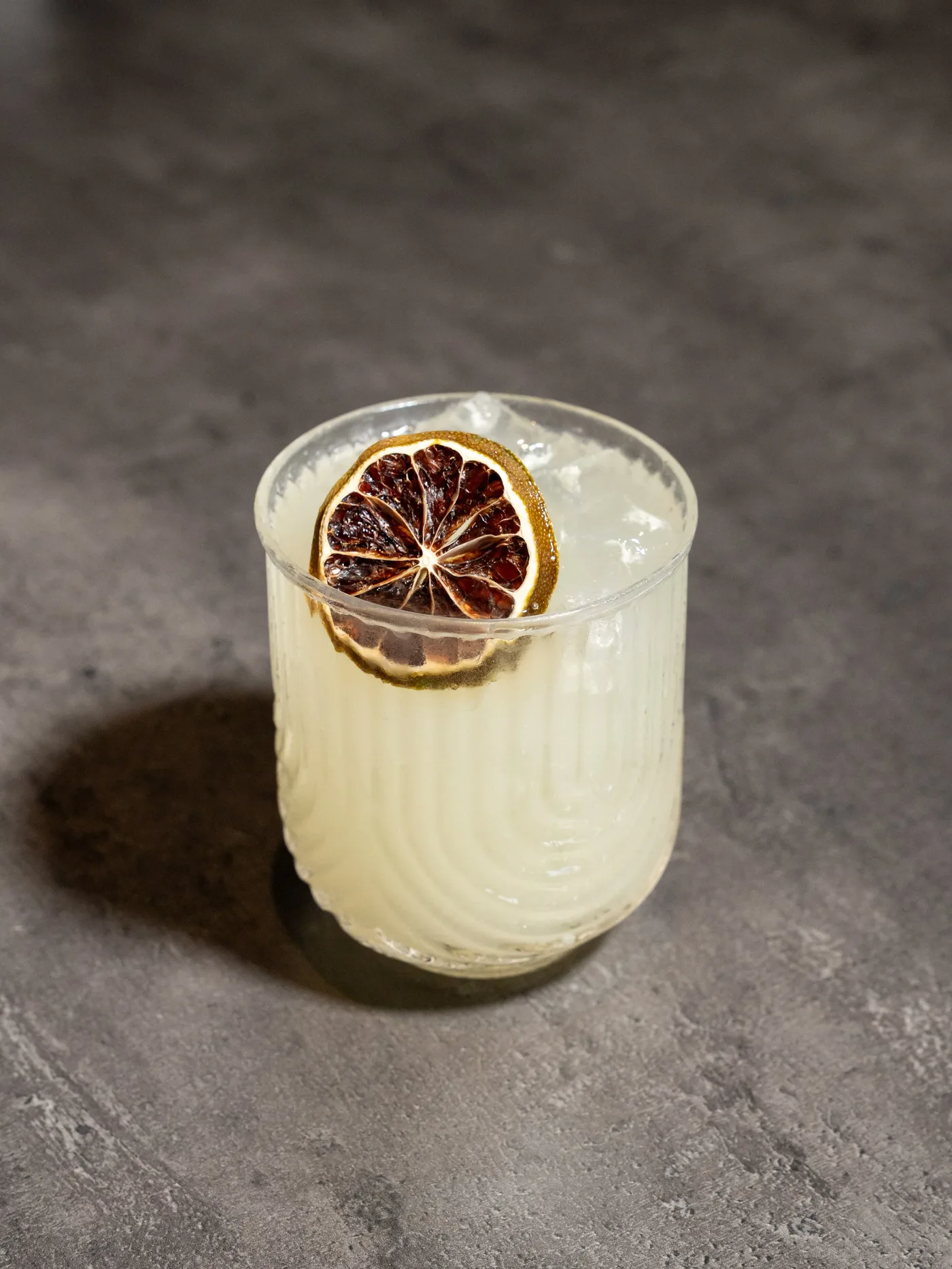 El Coco Loco cocktail with a dried lime wheel